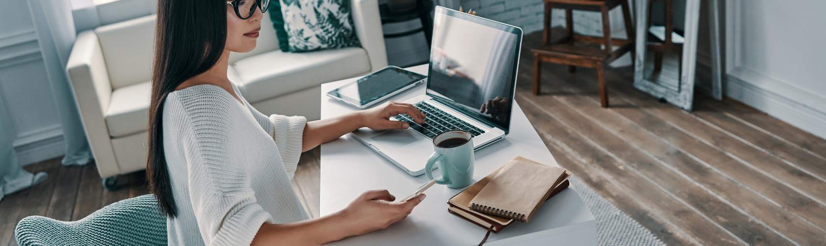 Woman working on a laptop at home